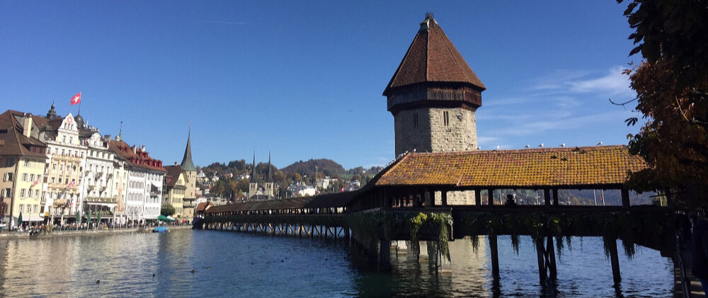 Chapel Bridge and the Water Tower beside Lake Lucerne in Switzerland